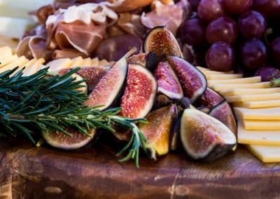 a plate of food with figs and cheese